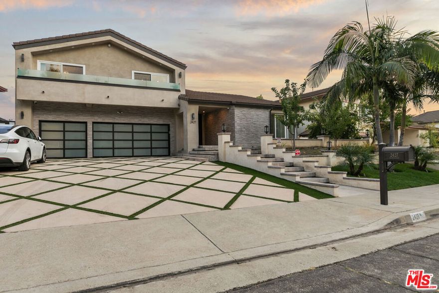 Welcome to 2427 Flintridge Drive, a fully remodeled masterpiece nestled in the tranquil hills of Glendale. Reimagined by the current owners with bold taste, soaring high ceilings, and flawless attention to detail, this home perfectly balances modern sophistication with natural beauty. Step inside to an expansive open floor plan filled with light, where sleek lines, designer finishes, and custom craftsmanship create a seamless flow between living, dining, and entertainment spaces. The gourmet kitchen features elegant cabinetry, premium appliances, and artistic touches that make every detail stand out. Glass doors open to a private view deck capturing breathtaking mountain panoramas, ideal for morning coffee, sunset gatherings, or quiet reflection under the stars. Every corner of this residence exudes creativity and luxury, from the refined bathrooms to the serene primary suite that feels like a modern retreat. A true statement home; bold, refined, and unforgettable, offering the best of Glendale hillside living.