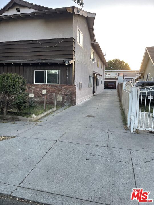 This property offers multiple units, each with spacious living areas and ample natural light. For those looking for an investment opportunity or extended family living, the property features well-maintained interiors and a convenient location close to local amenities and transportation options. Don't miss the chance to explore the potential of this multi-unit residence. The Rents are excellent and the current Tenants present no problems. This a great business opportunity.