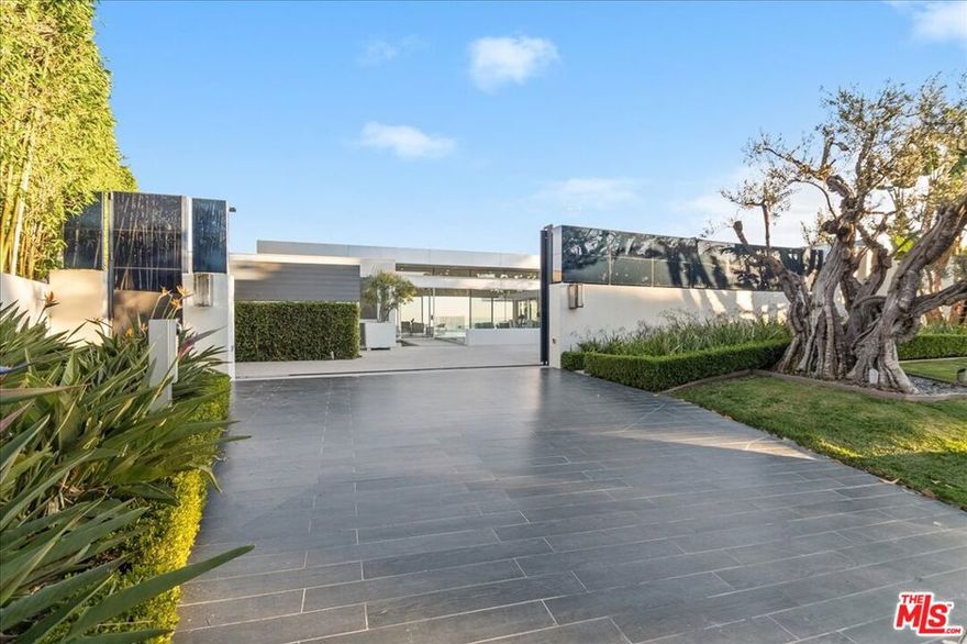 Welcome to this stunning residence located at 1620 Carla Ridge in the prestigious Trousdale, Beverly Hills, CA 90210. This exquisite property offers a luxurious and sophisticated living experience in an exclusive neighborhood. Designed by Paul McLean Architectural Estate.  A complete privacy behind 12-foot glass gate. Upon entering, you are greeted by a grand foyer that leads to an expansive living area, opens to unobstructed magnificent view of city light to the Pacific Ocean.  An incredible outdoor living space negative-edge infinity pool, spa, BBQ & exterior kitchen.  This home offers the perfect blend of California indoor-outdoor living. The 10,000 sqft home boasts 6 bedrooms & 9 baths automated by a Crestron System.  3 Bedrooms in the mail level, and 3 bedrooms downstairs.  Movie Theater, Game Room & Bar, a Lounge, Wine walk-in cellar, Gym/Steam Room, landscaped Zen courtyard with mature Olive Tree and fountains. The SieMatic kitchen features high quality surfaces and is fitted with the absolute best in modern technology and conveniences. The primary bedroom offers a serene retreat with a spa-like ensuite bathroom and a large walk-in closet. Located in the heart of Beverly Hills, this home is just moments away from world renowned "Rodeo Drive" providing easy access to fine dining, shopping, and entertainment. Schedule a showing today and experience the epitome of luxury living at 1620 Carla Ridge.