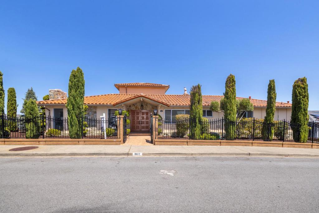 Welcome to 1822 Sebastian Drive. A stunning home that pairs space and style with extraordinary San Francisco Bay and SFO airport views, nestled in Burlingame's prestigious Mills Estates. Perched on an expansive 8,758 sq ft lot, this 3,280 sq ft residence features four bedrooms and two-and-a-half bathrooms, including a spacious primary suite with a walk-in closet, stall shower, and jetted tub. The chef's kitchen offers two gas ranges, granite countertops, and ample cabinetry, ideal for both daily meals and entertaining. Hardwood floors and skylights enhance the home's bright, inviting atmosphere. Living spaces include a formal living room, dining area, and separate family room for comfort and flexibility. Upstairs, a large bonus room takes full advantage of the home's elevated position, showcasing panoramic views of the Bay, city skyline, and SFO. A perfect home office, media room, or guest retreat. Additional features include in-garage laundry, a wet bar, and a two-car garage. Conveniently located near top-rated schools, downtown Burlingame, SFO, Caltrain, and major highways, this home blends comfort, convenience, and captivating views that define Peninsula living.