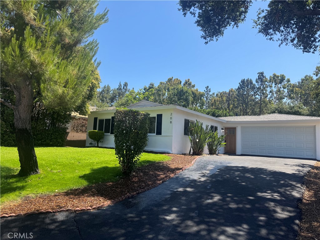 Welcome to this beautifully upgraded 3-bedroom, 2-bathroom home situated on a spacious lot in one of San Dimas' most desirable neighborhoods. No detail has been overlooked in this top-to-bottom renovation! Enjoy peace of mind with a brand new roof, retrofit windows, and fresh interior and exterior paint.
Step inside to discover luxury vinyl plank flooring throughout, complemented by modern baseboards and sleek casing. The brand-new kitchen is a showstopper, featuring white shaker cabinets, quartz countertops, stainless steel appliances, and a stylish tile backsplash—perfect for both everyday living and entertaining.
Both bathrooms have been fully remodeled with designer tile and new vanities, offering a fresh and contemporary feel. Outside, the upgraded sprinkler system helps maintain the lush landscaping, while the generous backyard provides endless possibilities for outdoor enjoyment.
Ideally located within walking distance to charming Downtown San Dimas and highly regarded Damien High School, this move-in-ready home combines modern upgrades with unbeatable convenience. Don't miss your opportunity to own this turnkey gem!
