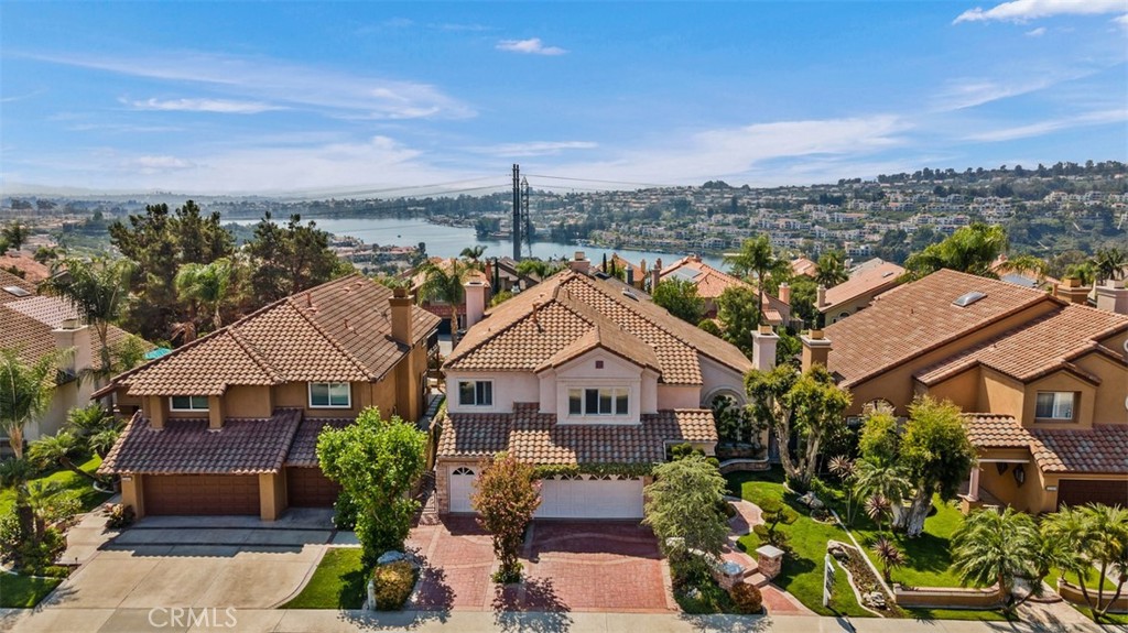 EXECUTIVE 3243 SQFT CANYON CREST HOME PERCHED HIGH ON A HILL W/BEAUTIFUL VIEWS OF THE CITY LIGHTS, HILLS & LAKE MISSION VIEJO! AN EXCELLENT LOCATION ON A CUL-DE-SAC STREET BACKING TO COMMUNITY DOWNHILL SLOPE. PROFESSIONALLY LANDSCAPED GROUNDS! THE FLOOR PLAN IS OPEN & INVITING W/CATHEDRAL CEILINGS. THE DOWNSTAIRS CONSISTS OF A LARGE LR, FORMAL DR, SPACIOUS KITCHEN, FAMILY ROOM, LAUNDRY RM, FULL BATH & OFFICE (CONVERTED 4TH BR). A SPIRAL STAIRCASE LEADS UP TO THE LARGE MASTER SUITE W/FP & TALL CEILINGS. FRENCH SLIDING DOORS OPEN TO A LARGE BALCONY W/SWEEPING VIEWS! THERE ARE TWO SECONDARY BEDROOMS W/JACK & JILL BATHROOM ALONG W/A SPACIOUS BONUS ROOM. THIS HOME HAS A LONG LIST OF QUALITY IMPROVEMENTS INCL NEW CARPET, MARBLE FLOOR, CUSTOM OFFICE & BONUS ROOM BUILT-INS, CUSTOM INTERIOR PAINT, DUAL WINDOWS & DOORS, GARAGE BUILT-INS & MUCH MORE! THE REAR PATIO & YARD ARE A PERFECT PLACE TO RELAX AND ENJOY! INCLUDES A BBQ W/BAR FOR THOSE FAMILY GATHERINGS! CANYON ESTATES OFFERS SOME OF THE VERY BEST COMMUNITY AMENITIES IN SOUTH ORANGE COUNTY, INCLUDING POOL, SPA, GYM, CLUBHOUSE, MEETING ROOM, EXCELLENT TENNIS, SPORT COURTS, CHILDRENS PLAY AREAS, BEAUTIFUL LUSH GROUNDS & MORE! INCLUDES MEMBERSHIP TO LAKE MISSION VIEJO W/BOATING, 2 BEACHES & WORLD CLASS FISHING!