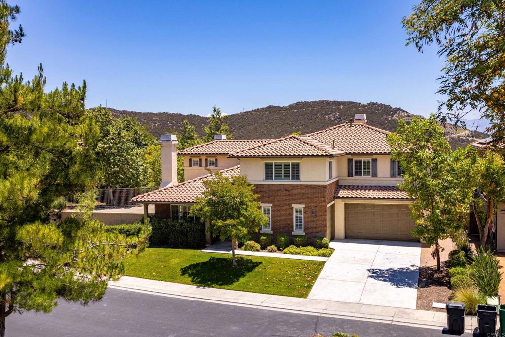 Exquisite DAVIDSON-Built Home in Guard-Gated Greer Ranch. Rarely available 4 bed + loft, 4.5 bath, 3,863 sq ft home located ona quiet cul-de-sac with no rear or across-the-street neighbors. Close to the community clubhouse, pool, spa, and playground. Thisbeautifully designed home features formal living and dining rooms, solid hardwood flooring, high ceilings, and 3 fireplaces. Thegourmet kitchen offers granite countertops, stainless steel appliances, a large center island, ample cabinetry, and a walk-in pantry.Downstairs includes the intergenerational suite with a private living area, bedroom, and full bath—perfect for guests, in-laws, or aprivate office. Additional features include a spacious family room with scenic views, plantation shutters, a laundry room with sinkand storage, and a 3-car garage with built-ins and newer 75-gal water heater (2021). Upstairs offers a large loft with solidhardwood, two secondary bedrooms, both with bathrooms, (one ensuite), as well as luxurious primary suite with fireplace, balcony,spa-like bath, and custom walk-in closet. Enjoy outdoor living with a paver patio, fenced turf yard, and large side yard ready for apool—all with panoramic valley and mountain views. Greer Ranch features 24-hour guard-gated security, resort-style amenities,trails, and is located in the top-rated Murrieta school district. A must-see!