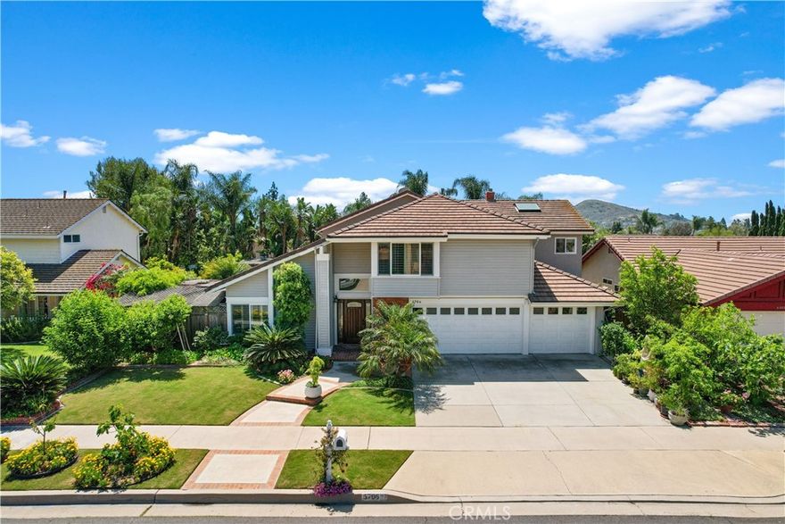 Prime Orange Location, ELEGANT MABURY RANCH HOME | ENTERTAINER'S DREAM BACKYARD. A gardener's haven, THOUGHTFULLY upgraded house. Welcome to 5706 E Bryce Avenue, a gorgeous two-story residence in the coveted Mabury Ranch neighborhood. This exquisitely designed home, which has 4 Master Bedrooms and 4 Master Baths, and a powder room downstairs, is the ideal place to call home because it seamlessly combines practicality, comfort, style, and functionality. With high ceilings, amazing natural light, and a stunning staircase separating the open formal living room and adjacent dining room, the home's light-filled layout lends a sense of tranquility from the moment you enter. The kitchen's Wood cabinets, Viking gas stove,  stainless steel appliances, and premium QUARTZITE quartz heat-resistant surfaces are some of the features of this fabulously remodeled kitchen. The open and bright large family room is perfect for daily living and entertaining. The large Master Suite downstairs is Perfect for a JDU, game room, or home office, with plenty of light and a glass sliding door. This huge master suite has a fully renovated bathroom, kitchenette, and laundry ready for a JDU or a master suite on the first level of the house. The first level is completed with an indoor laundry room and a half bathroom. 3 Upstairs Master bedrooms all have full bathrooms,  large wardrobe space, and fully renovated bathrooms, and the luxurious primary suite upstairs provides a tranquil haven. Two of the bedrooms on the second floor are complete suites, which come with a kitchenette and a washer and dryer hookup. A three-car attached garage, an EV charger,  an additional storage space on the main floor, and an abundance of storage beneath the stairs are further attractions. Enter the backyard, a magnificent haven for entertainers and gardeners. The mood is set for leisure and enjoyment by the lovely zen garden, two exquisite fountains, and the exquisitely designed backyard, wolf grill, Bermuda lawn in the backyard, and front yard encircled by lush landscaping,  and plenty of places to lounge, entertain, and relax. Numerous outside parties are encouraged by a lovely barbecue, a fireplace with a fan, an entertainment area, and an eating area. This garden is perfect for entertaining guests in the summer or spending peaceful evenings beneath the stars. This house is close to neighborhood parks, hiking trails, and well-regarded schools in the center of Mabury Ranch. owner-owned FULL Solar power.