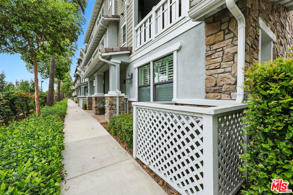 Prime location end unit. Here is an opportunity to own an elegant designer tri-level end unit townhouse nestled in the vibrant well maintained community of Whittier. As you enter this stylish well maintained tri-level home built in 2016 you will marvel at the many thoughtfully designed upgrades that make living here super comfortable. The convenience of an attached spacious 2-car garage makes coming home from a busy day something to look forward to pulling into and offers direct access to the main entry foyer. The large garage also has storage areas/shelves This lower level features one of two primary suites perfect for guests or in-laws. . There are numerous amenities throughout this townhome. The second level where natural light floods the open floorplan creating a warm and inviting atmosphere. At the heart of this townhome is a gourmet kitchen, a chef's delight, complete with sleek stainless steel appliances, ample cabinet space, a walk-in pantry and Kitchen cabin twith all pullout shelves and a spacious island great for casual dining or entertainment. The are two absolutely beautiful crystal pendant chandeliers over the entertainment island that of all the features this townhome has to offer, certainly should be put at the top of the list. The kitchen seamlessly connects to an open living room which boasts a private balcony that overlooks the famous greenway trail and a perfect retreat for enjoying peaceful morning to have coffee or tea or to come home to after a long day to unwind with a beverage or cocktail. on the 3rd level where you will find a spacious laundry, 2 bedrooms with ample closet space and a primary suite with walk in closet and a well apportioned ensuite bathroom wit shower and tub. This townhome is an end unit in a community which is blocks away from the Historic Uptown Whittier Community, shopping and dining. Amesbury Circle features: a kis playground, BBQ grills, picnic area and a thoughtfully designed dog park for those with fur babies. And one mustn't forget the community access to the Greenway walking and biking trail. This townhome is a great buy. I wouldn't wait.