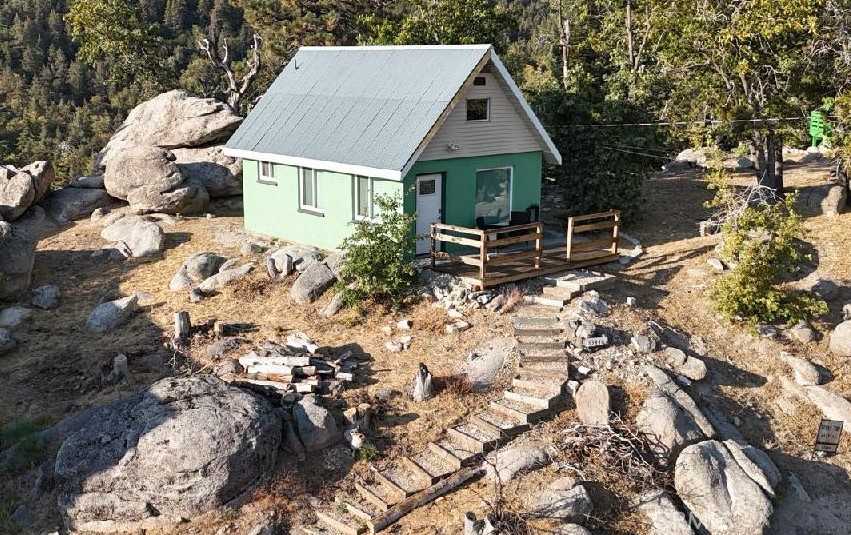 Charming Mountain Cabin with Stunning Views & Proven Short-Term Rental Appeal
Welcome to your mountain escape! Perched among massive boulders and mature pines, this cozy cabin offers the perfect blend of rustic charm and modern updates. Relax on the private outdoor patio with panoramic forest and mountain views, or enjoy the warmth of the cabin’s inviting interior featuring exposed wood beams, a lofted sleeping area, and an open-concept living space. Offered completely furnished, this home is truly turn-key—ready for you or your guests from day one.
The property’s unique setting provides privacy and tranquility, while still being conveniently accessible. Outdoor enthusiasts will love the surrounding hiking trails, fresh mountain air, and endless opportunities to connect with nature.
Investor Opportunity: This cabin has a strong history as a successful short-term rental, with past occupancy and income reports available upon request.
Highlights:
• Picturesque mountain setting with incredible views
• Outdoor entertaining space with patio seating among the boulders
• Charming loft bedroom with rustic beams
• Offered fully furnished & turn-key
• Proven short-term rental appeal (reports available upon request)
• Convenient access to mountain recreation, dining, and amenities
• This is more than just a cabin—it’s an investment in lifestyle and potential income. Don’t miss the chance to own this unique mountain retreat!•