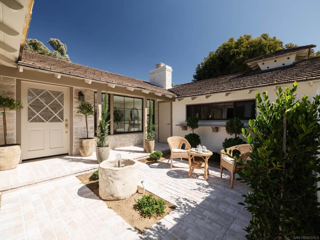 Luxurious Single-Story, European-villa inspired home on an 8,000 sq.ft. Flat Lot—with privacy—in coveted North La Jolla. From the moment you pass through the private entry gate, you’ll notice no expense has been spared, with rich details from floor to ceiling. The kitchen is a dream, showcasing top-of-the-line flush custom cabinetry, elegantly selected countertops, and French doors that open to an entertainer’s backyard—flat, green, expansive, and perfect for large gatherings. An in-ground spa, shaded alfresco dining and barbecue area, and mature trees complete this private and quiet enclave. Don’t miss this Rare North La Jolla home with easy access to the beach, trails, freeways and top schools, this home truly has it all!