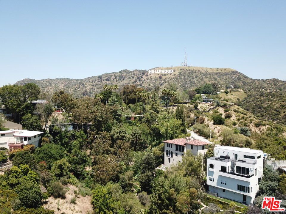 Seize this incredible opportunity to develop a luxury home on a 7,882 SF lot, zoned LARE9, in the prestigious Hollywood Hills East. This vacant lot boasts breathtaking, expansive city views, stretching from the iconic Hollywood Sign to Century City and Downtown LA from the top of the lot. Nestled in a tranquil neighborhood, yet conveniently close to Sunset Blvd, this prime location offers the best of both worlds - serenity and accessibility. Surrounded by multi-million dollar homes, the property is just minutes from the vibrant Sunset Strip, offering easy access to restaurants, shops, freeways and more. Seller said this is SB9-Approved Lot - cleared by the City of LA Planning Department for development under SB9, allowing up to 2 units with ministerial (no-discretion) approval and no parking requirement. Seller has previously approved geo report available upon request and has pre-verified planning department confirmation of SB9 eligibility (but buyer should verify on their own and rely on their own investigations). Skip the lengthy discretionary reviews; permits are streamlined. Ideal for investors/builders targeting LA's infill market. No hurdles- just build. This is your chance to build your dream home with unparalleled views in one of LA's most coveted neighborhoods. Utilities should be nearby.