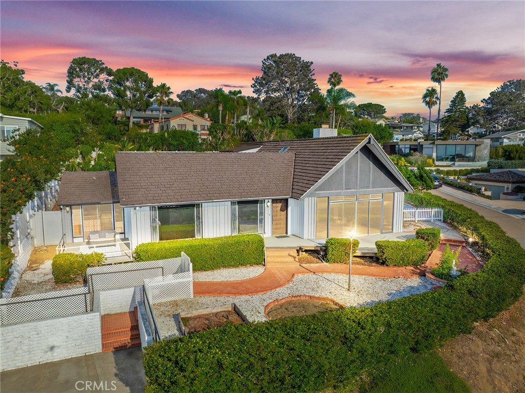 RARE OCEAN VIEW GEM IN PRIME DEL MAR LOCATION! Seize this once-in-a-lifetime opportunity to own a truly charming home boasting stunning ocean views in highly sought-after Del Mar! Imagine stepping out your front door and onto a picturesque walking trail that leads you directly to the sandy beach and vibrant Powerhouse Park. This exceptional residence offers the ultimate coastal lifestyle with unparalleled convenience. Indulge in the nearby dining and boutique shopping that Del Mar is famous for. For entertainment enthusiasts, the iconic Del Mar Fairgrounds and Racetrack are just moments away, as is the scenic San Dieguito Lagoon, offering walking trails to explore. Inside, you'll be greeted by high ceilings and a warm, inviting atmosphere. Cozy up by the fireplace on cooler evenings or work from home in the dedicated office/den. A unique bonus awaits with a fantastic Accessory Dwelling Unit (ADU) located above the workshop, complete with its own living room, bathroom, and bedroom – perfect for guests, extended family, or potential rental income. Embrace the idyllic Del Mar weather in the bright and airy sunroom or on one of the multiple patios, designed for seamless indoor-outdoor living. The property is enclosed with elegant vinyl fencing, creating a private oasis in a quiet and luxurious neighborhood. Words can hardly capture the magic of this home. This is a must-see to truly appreciate the exceptional location, breathtaking views, and unique features it offers. Don't let this rare opportunity slip away. CALL TODAY TO SCHEDULE YOUR PRIVATE SHOWING!