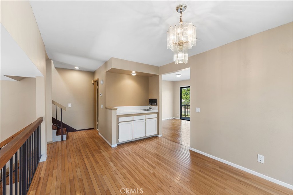 Welcome to this spacious 3-bedroom, 2.5-bath tri-level end-unit townhome located in a secure, gated community in the heart of West Hills. Light-filled and thoughtfully designed, this home combines modern comfort with timeless elegance. Step into the inviting living room featuring a cozy fireplace and stunning marble flooring, setting the tone for stylish living. Elegant hardwood and laminate floors flow throughout the home, complementing the refined ambiance. The formal dining room with a built-in wet bar is perfect for entertaining, while the adjacent breakfast nook offers a charming space for casual meals. Upstairs, retreat to the expansive primary suite, complete with soaring ceilings, a private en-suite bath, and a built-in sauna for your own spa-like escape. Natural light pours in through a large skylight above the stairway, enhancing the airy feel throughout the home.
Enjoy your morning coffee or evening unwind on the spacious private patio and balcony, ideal for indoor-outdoor California living. Additional conveniences include an in-unit laundry area and an attached 2-car garage with direct access. This well-maintained, resort-style community offers premium amenities, including a sparkling pool, relaxing spa, tennis court, and secure gated entry.
Don’t miss this rare opportunity to own a corner unit in one of West Hills’ most desirable complexes—close to shopping, dining, parks, and top-rated schools.