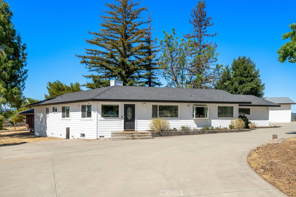 Welcome to this one-of-a-kind ranch home tucked into a serene 6.6-acre setting that will ensure privacy and opportunity for generations.
The spacious 5-bedroom, 2-bathroom home is nestled in Templeton, the heart of the Central Coast’s sought-after countryside. An expansive country home that’s also close to downtown Paso Robles and San Luis Obispo’s culinary epicenters includes native shrubs and oaks with plenty of room to roam and grow your own private compound. Whether you’re an equestrian or an aspiring wine grower, or even if you just need space to breathe, it’s all here.
Built in 1979, the midcentury architectural design features high ceilings and an abundance of large windows that stream light into the home from the outdoor spaces at every turn. The natural light also creates a warm and welcoming atmosphere that will suit multiple generations who are sure to enjoy this space as a place to live, grow and thrive
The home’s open floor plan features both entertaining spaces and tucked-away private hideaways. The primary suite features a recently remodeled bathroom with dual sinks and a walk-in closet. Five rooms will give the next residents room to grow a family or a place for a home office, a workout room, or a cozy study.
But the highlight is the splendor of the property. Step outside and take in the untouched California countryside and nearly limitless outdoor activities and adventure. Want to host an evening cookout? There’s a built-in Santa Maria-style barbecue. Friends in town for the weekend? There’s plenty of room for RV parking on the side of the semi-circular driveway. Into your toys? An oversized two-car garage with additional boat parking, and bonus 450 sq ft shed awaits.
It doesn’t take more than one look to discover this private, multi-acre oasis creates a memorable retreat that offers not only instant relaxation but unlimited indoor and outdoor opportunities.