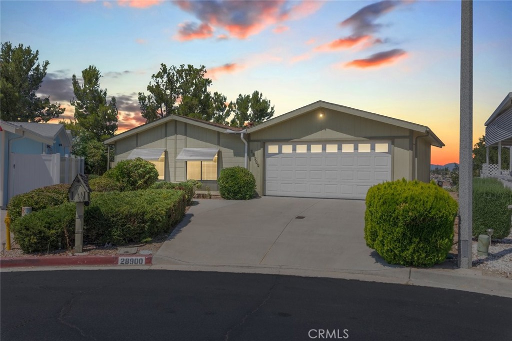 VIEWS, VIEWS, VIEWS!!! Don’t miss this rare opportunity to own a beautifully located home in the highly desirable 55+ Spring Knolls community. Situated at the end of a desirable cul-de-sac and perched atop a bluff, this charming 2-bedroom, 2-bathroom home offers breathtaking westward sunset views and an exceptional lifestyle with LOW taxes and LOW HOA fees. With 1,440 sq. ft. of well-designed living space, this home features a thoughtful floor plan with spacious bedrooms separated on opposite sides of the house for privacy. The primary suite is oversized and includes a walk-in closet, dual sinks, and a vanity area, while the second bedroom also boasts generous proportions and mirrored closet doors. The heart of the home is an open-concept great room, seamlessly connecting the kitchen, family room, and living room—ideal for both daily living and entertaining guests. Step outside and enjoy the expansive lot, complete with a large side yard patio, patio cover, and mature trees offering shade and serenity. Whether you're relaxing or hosting, you’ll love taking in the panoramic sunset views every evening. Additional features include a spacious storage shed along the front walkway and ample outdoor space—a rare find in this community. View lots like this don’t come around often—schedule your private showing today!