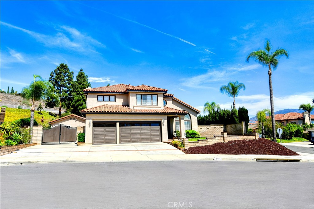 Welcome to this exquisite 2-story view home nestled in the prestigious Yorba Linda Hills, offering a perfect blend of luxury, comfort, and functionality on an expansive 11,000 sq. ft. lot. The main residence spans 2,465 sq. ft. and showcases 3 spacious bedrooms and 2.5 beautifully updated bathrooms, complemented by a detached 500+ sq. ft. casita with its own full bath—ideal as a private in-law suite, guest retreat, home office, or entertainment space. Upon entry, the grand foyer with soaring cathedral ceilings and abundant natural light leads into an elegant living and dining room enhanced by custom wood shutters and timeless tile flooring throughout. The gourmet kitchen is a chef’s dream, featuring high-end quartz countertops, a full suite of luxury appliances including Sub-Zero built-in refrigerator, Dacor convection oven and microwave, Fisher & Paykel DishDrawer, Kohler pot filler, custom tile backsplash, and extensive cabinetry for maximum storage. The kitchen seamlessly opens to the oversized family room with a cozy fireplace and wall of windows overlooking the resort-style backyard with sparkling pool, spa, and built-in BBQ under a covered patio—perfect for year-round entertaining. Upstairs, the luxurious primary suite boasts vaulted ceilings, dual walk-in closets, and a spa-inspired bathroom with dual quartz vanities, frameless glass shower, and Whirlpool Hydrotherapy tub, while two additional large bedrooms with dual-paned windows and a full bath with quartz counters complete the upper level. Additional highlights include convenient inside laundry, a spacious 3-car garage, RV parking, and a flat usable lot with endless potential. With no HOA fees, no Mello Roos, and zoned for top-rated Bryant Ranch Elementary, Travis Ranch Middle, and Yorba Linda High School, this property represents the ultimate opportunity to experience upscale California living in one of Yorba Linda’s most desirable neighborhoods.