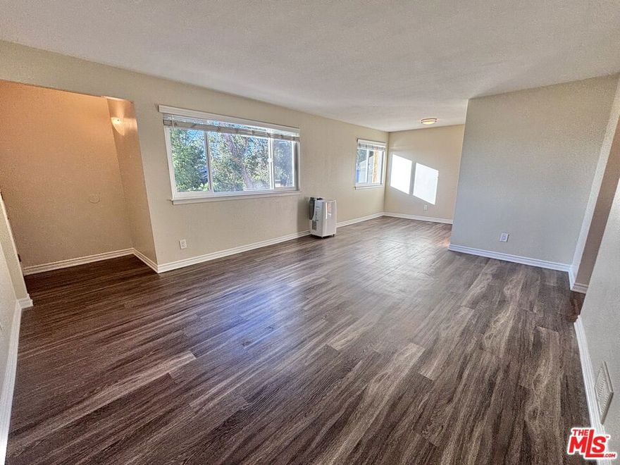 Welcome to Alvarado Gardens, a peaceful hillside community perfectly positioned between two of the East Side's most desirable neighborhoods. This quiet and spacious three-bedroom apartment is one of two units on the second floor with minimal shared walls! Inside, a bright, open living area flows seamlessly into a sleek kitchen outfitted with stainless-steel appliances, including a gas range, microwave, refrigerator, and dishwasher. The primary bedroom features an en-suite half bath and generous closet space, while a full bathroom is conveniently located down the hall. Additional highlights include two separate entryways, a new portable AC unit, plenty of storage throughout, and beautiful views. Conveniently located on the border of Echo Park and Silver Lake, this 80-unit complex is minutes from the Silver Lake Reservoir, Elysian Park, and Echo Park Lake, plus an easy commute to the 2, 5, and 101 freeways.Includes up to three dedicated parking spots and community laundry. Owner covers gas, water, trash, & sewer. Sorry, no pets allowed.