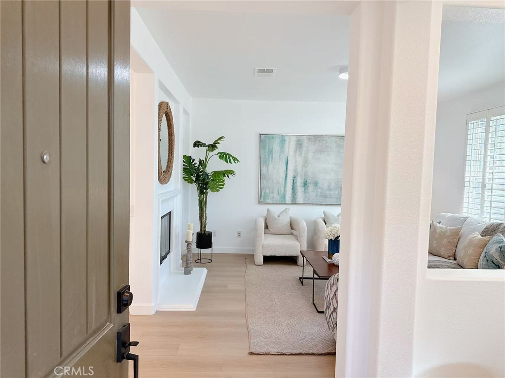Welcome to this beautiful corner home located in the highly sought-after Portola Springs community of Irvine! Boasting 3 bedrooms, 2.5 bathrooms, and 2,023 sq. ft. of thoughtfully designed living space, this two-story residence offers comfort, functionality, and style. The open floor plan is highlighted by soaring high ceilings, recessed lighting, and an abundance of natural light that fills every room. The main floor includes a versatile office/bedroom and a convenient bathroom, perfect for guests or a home workspace. Enjoy cozy evenings by the fireplace in the spacious living area, and appreciate the built-in cabinets that provide extra storage. The modern kitchen seamlessly connects to the living and dining areas, making it ideal for both everyday living and entertaining. Upstairs, you’ll find two secondary bedrooms and a generously sized primary suite complete with a walk-in closet and a luxurious en-suite bath featuring double sinks, a soaking tub, and a separate shower. Additional highlights include a beautifully landscaped front yard, an attached two-car garage, and the charm of being a corner home built in 2006. Enjoy resort-style amenities including sparkling community pools and spa, tennis and basketball courts, parks, and scenic walking and biking trails. Zoned for the award-winning Irvine Unified School District and just a short walk to Portola Springs Elementary. Conveniently located near the Woodbury Town Center, Irvine Spectrum, Great Park Sports Complex, and the upcoming Canopy Shopping Plaza. Don’t miss this incredible opportunity to live in one of Irvine’s most desirable neighborhoods look no further, this is the one!