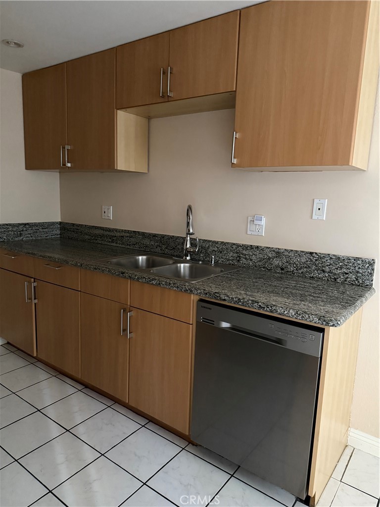 Featuring two spacious suites, private patio, in-unit laundry, and a remodeled kitchen. Immaculately clean and move-in ready. Located on a quiet street in a well-maintained building with two parking spaces and access to a community pool.