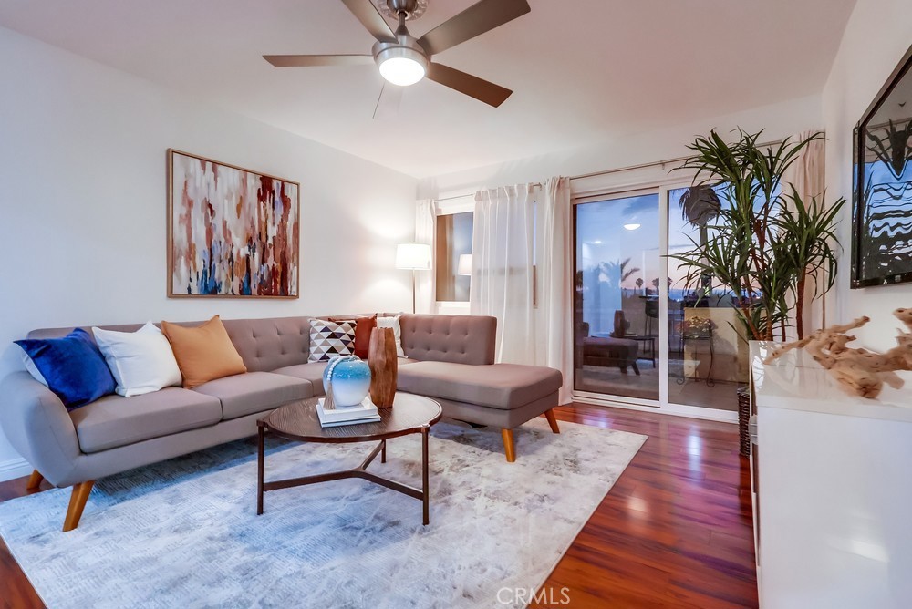 Welcome to this beautifully updated 2 bedroom/2 bathroom top-floor condominium near vibrant downtown Long Beach. The home features a custom kitchen with elegant cabinetry featuring soft-closing doors and drawers, granite countertops, recessed lighting and stainless-steel appliances, including a brand-new LG refrigerator. The kitchen is open to a breakfast bar that seamlessly connects to the light and bright living area with updated with laminate flooring and sliding glass doors that lead to the balcony with peekaboo views of the downtown, the port and the Palos Verdes Peninsula. Both bedrooms also have large windows with westerly views and plenty of natural light. The primary suite is spacious with an en-suite bathroom and plenty of closet and storage space. The newer window AC unit and ceiling fans ensures comfort, while the newer forced heating system keeps the unit cozy during cooler nights. Fresh interior paint throughout, laminate flooring, updated lighting, and dual-pane vinyl windows make this home completely move-in ready, and the 1 subterranean parking space, elevator access, and community laundry facilities provides additional convenience. Don’t miss out on this fantastic opportunity to live near shopping, restaurants, entertainment, public transportation, and the shoreline. Schedule your viewing today and discover your new home!