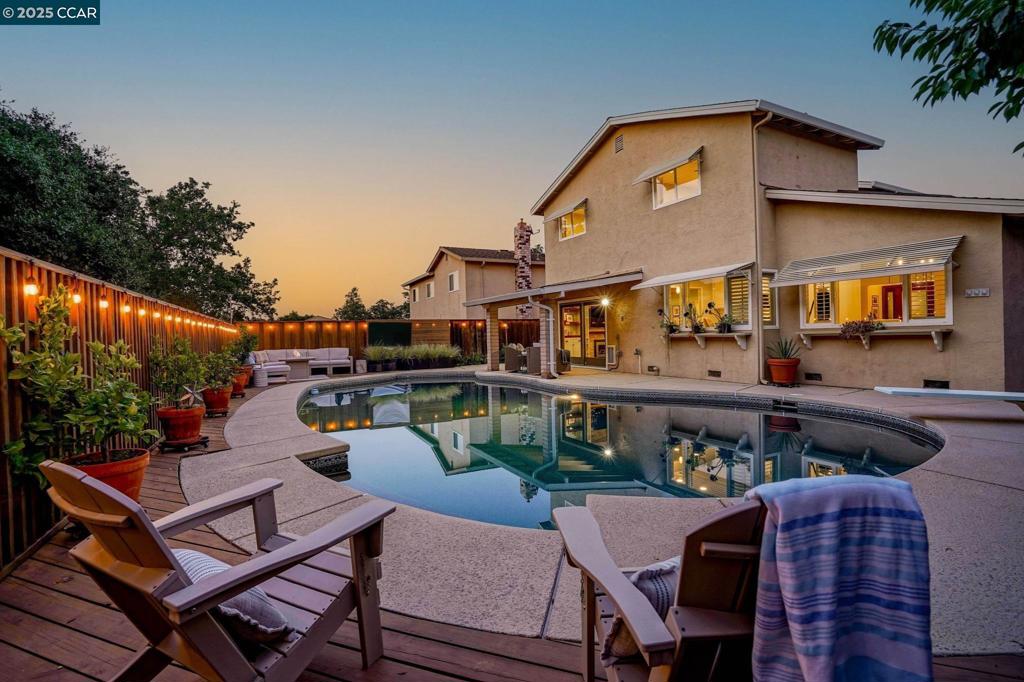 Tucked at the end of a quiet court in the sought-after Hidden Lakes neighborhood, this beautifully updated home offers modern style, smart functionality, and an entertainer’s dream outdoor space. No rear neighbors and direct trail access to Hidden Lakes Park. Kitchen features beautiful quartz countertops, white cabinetry, and farm sink, and modern appliances—all with views of the stunning backyard. New wide plank LVP flooring throughout. Spacious living and dining areas with vaulted ceilings and picture windows that flood the space with natural light. A private front courtyard welcomes guests and adds a peaceful outdoor retreat at the entry. This home offers two distinct living rooms; ideal for entertaining. Just off the main living area, a custom wine bar and half bathroom provide the perfect setup for hosting. Upstairs, the oversized primary suite features vaulted ceilings, dual closets, and a serene ensuite bath. A built-in desk nook in the upstairs hallway adds functionality for work or study from home. The expansive outdoor space features a sparkling pool with diving board, an outdoor TV, multiple lounge zones, and a covered patio. Additional features include owned solar, EV charger, and an attached two-car garage. Close proximity to parks, trails, shops and more!