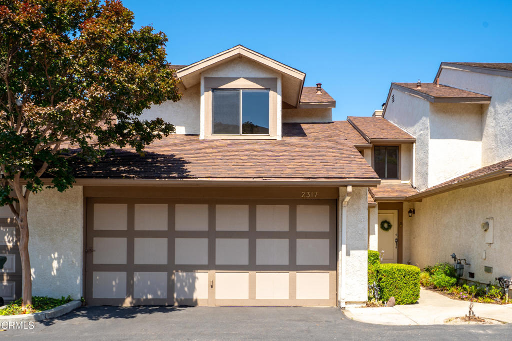 Charming Paseo Del Mar townhome in a tranquil park-like setting with a distant peek-a-boo island view. Welcome to this thoughtfully designed 2 bedroom, 2.5 bathroom home offering 1,263 sq. ft. of comfortable living in the desirable Paseo Del Mar community in trending West Ventura. Set among mature trees and greenbelt-style landscaping, this two-story home offers a sense of calm and is located just minutes from Downtown Ventura, a variety of beaches, and the Ojai Valley.The main living space features a cozy fireplace and an open flow to the dining area and kitchen. Fresh updates include new carpet and new interior paint throughout - new forced air heater and new insulation. The kitchen provides ample counter space, a breakfast bar, and direct access to the attached 2 car garage - where you'll also find laundry hook ups with washer and dryer included. The convenient half bathroom downstairs is a huge bonus. Upstairs, both bedrooms are generously sized and each with dedicated en suite bathrooms! Just outside, a community park is right across the street - ideal for morning walks or spending time with pets. Residents also enjoy access to the community pool, spa, and playground.Conveniently located near Highway 33 and 101, this home makes it a fantastic commute location and easy to enjoy Ventura's beaches, vibrant downtown, and nearby boutique shopping and dining.