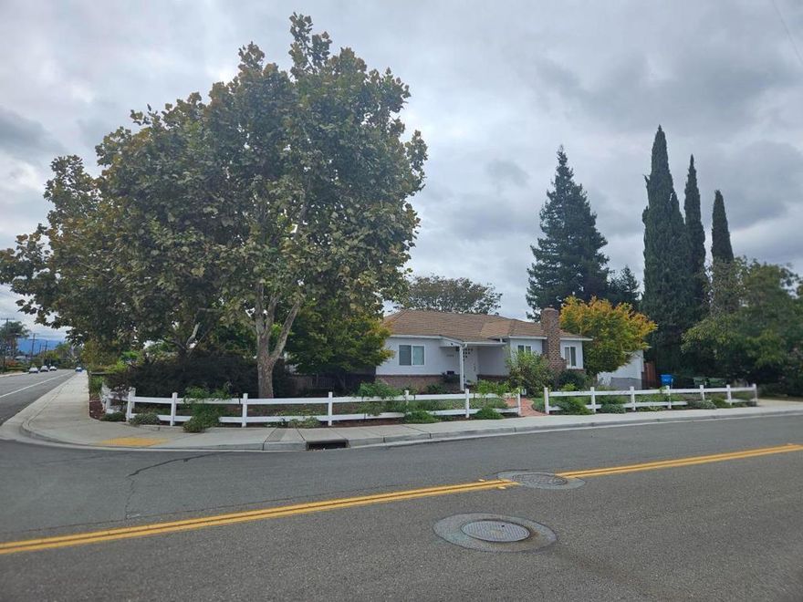 Beautifully landscaped, this 10,000sf corner lot has been owned by one family for decades. This spacious two bedroom, one bath home is move in ready. The neighborhood is vibrant. Located between Thomas Barrett Park and Parkway Park, walkers are present throughout the day and night. The well lit spacious living room, dining room and kitchen offer the versatility for hosting and entertaining. In addition, the large backyard provides additional opportunities to host a large group. Perfect for a single person, couples or those looking to downsize. The backyard is home to established redwood trees, 2 lemon trees, 2 orange trees, a walnut tree and a small rose garden. The home has an alarm system and cameras. Westfield Mall and Santana Row are in walking distance. Within 1 mile is O'Connor Hospital as well as medical and dental offices. On ramps to hwy 17 & 280 are nearby, as well as San Tomas Expressway. Within minutes is the San Jose Municipal Rose Garden, named "America's Best Rise Garden", as is Zanotto's and Lucky Markets. For education and entertainment, Santa Clara University is minutes away. Both San Jose Airport and downtown San Jose are a distance of 6 miles. The exceptional Santa Clara Police and Fire Department are nearby. Utilities are provided by the city of Santa Clara.