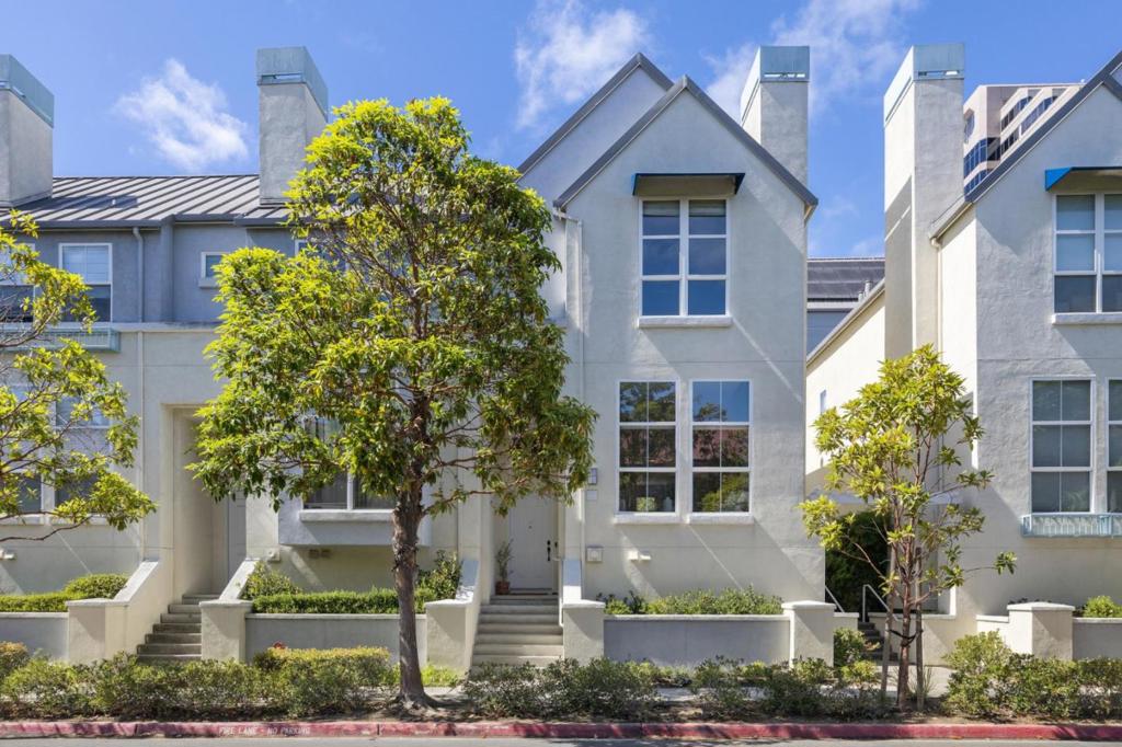 Exquisite and Stylish Living! A special property from an absolutely charming enclave of sophisticated dwellings situated in the heart of Foster City. This luxurious end unit townhouse residence is unique in design and flair, sporting several levels for easy, practical everyday living. Large 2 car garage accompanied with a one-way solitary private road. Gleaming oak hardwood floors, peaked ceilings,abundance of natural light, and an aura of open space defines the interior. Stunning in presentation, the living and dining areas combine to make the initial impact with a dynamic fireplace, impressive windows, designer light fixtures, and a wall to expose the adjoining kitchen/family area. Here lies a room for everyday living and attractiveness that portrays the heart of the home. The splendid blend of tasteful finishes with culinary pleasure is difficult to challenge. Upstairs are both en suite bedrooms, large and private. Both showcase a striking peaked roof, massive windows, stunning baths and custom closets. Additional amenities include a large central skylight, EV capability, additional storage, spacious laundry room, recessed lighting; and central heat. Close to schools, shopping, bay trails, parks, transportation, SFO, 101, and midway between SF and Silicon Valley.