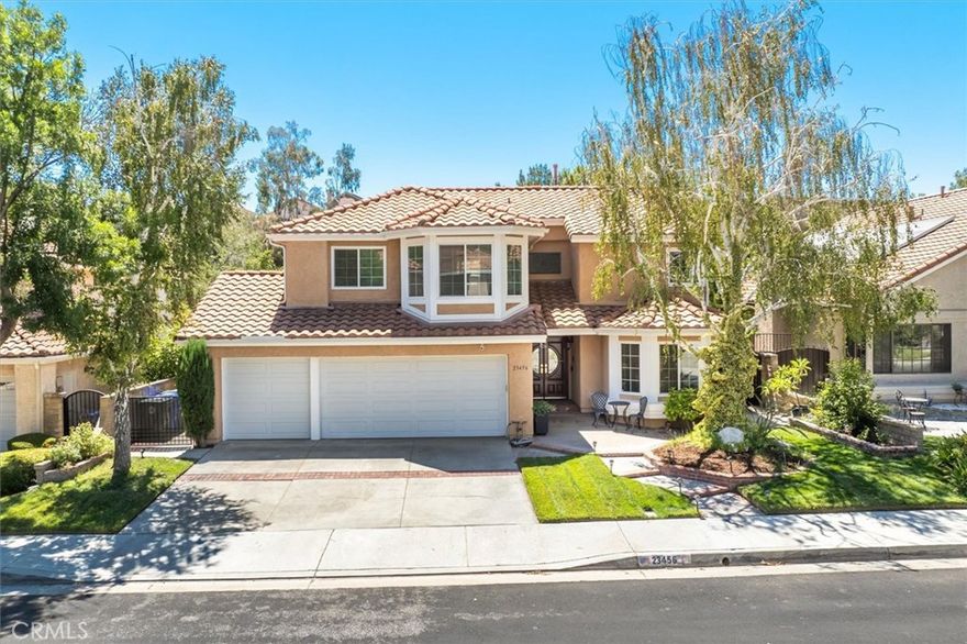 Luxury Meets Comfort in This Updated Multigenerational Hidden Valley Home in Newhall. This stunning 3-level, 6-bed, 4-bath home has been completely reimagined with upgrades and professionally staged by a designer to showcase its full potential. As you enter the home, the foyer on the main level open-concept layout is anchored by the show-stopping spacious living and dining areas with a private bedroom and full bath, perfect for guests. The family and living rooms are washed in beautiful natural light where french doors lead to the redesigned balcony to sit outside, sip your morning coffee or relax with a glass of wine while taking in the serene views. In 2024, the beautiful kitchen was taken down to the studs and rebuilt with sleek, modern finishes, premium appliances, and an effortless flow that makes entertaining a dream. At the same time, every window in the home was replaced, including a lifetime warranty, enhancing natural light and energy efficiency. In 2025, the transformation continues with new wood-look tile flooring, a striking redesign of the stairs and updated bathrooms, paired with designer lighting that adds warmth and sophistication. For ultimate comfort, the home is equipped with a newer smart HVAC system, featuring a fully automatic, self-cleaning air purification system and an extra year of seasonal maintenance included. Upstairs, the spacious primary suite is a true retreat with a seating area and featuring a remodeled luxurious en suite bath. The lower level, with its own private entrance, offers a full family/game room, plus a bedroom, and full bathroom — ideal as an in-law suite or guest quarters. Beyond the walls, you’ll find a peaceful, mature, and highly sought-after neighborhood — the perfect backdrop for this meticulously maintained masterpiece designed with multi-generational living in mind. Step outside to enjoy a warm summer evening around the backyard fire pit, grill your favorite meal, or relax with friends under the stars. Don't miss the wonderful storage area on the side of the house that helps keep your garage clear of all the extra boxes. And when you’re ready for a change of scenery, the community offers resort-style amenities — a pool, clubhouse, playground, tennis courts, and even pickleball which backs up to scenic hiking and biking trails! Perfectly located near top-rated schools, shopping, and minutes to the 5 freeway this move-in-ready home is more than a residence — it’s a lifestyle, ready to be enjoyed.