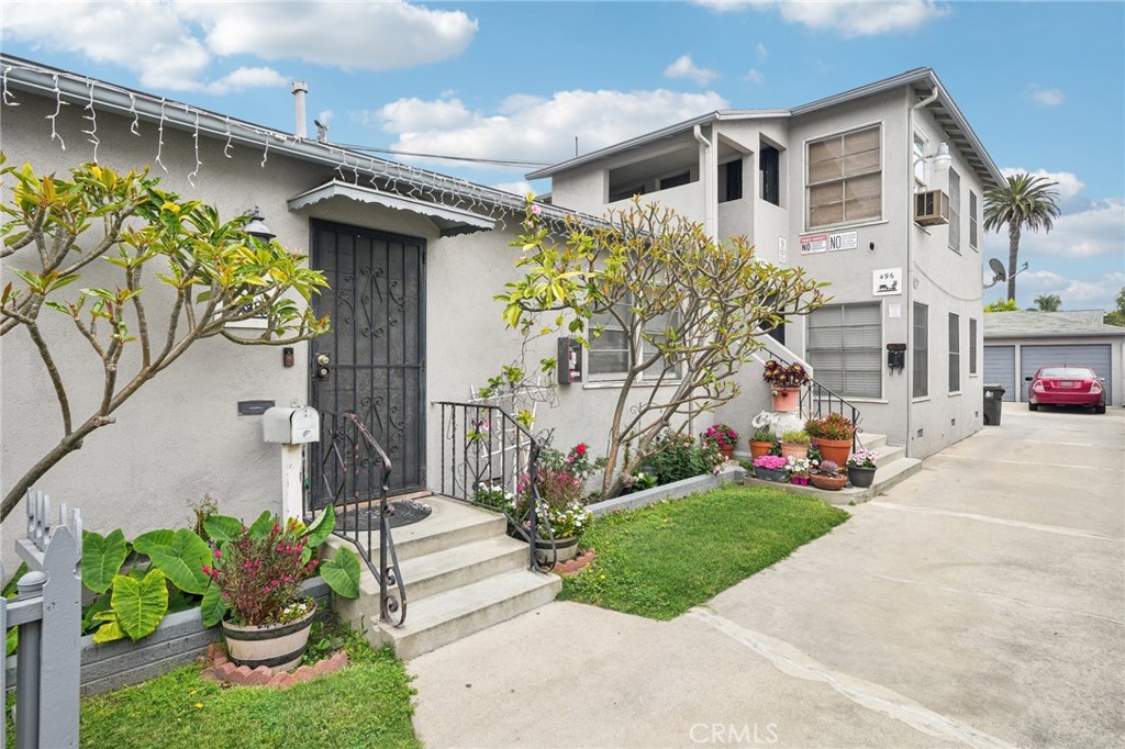 494 Almond Avenue is ideally situated in the desirable North Alamitos Beach neighborhood of Long Beach. This multifamily property consists of three (3) units, including a spacious three-bedroom, one-bath unit and two (2) one-bedroom, one-bath units. It also features three (3) private garages—an exceptional amenity in this highly parking-constrained area. One unit has been recently remodeled with permitted upgrades including new flooring, kitchen, bathroom, paint, and electrical systems. Each unit is separately metered for gas and electricity, helping to reduce operating costs for the future owner. The property offers strong potential for added value, including the possibility of converting the garages into Accessory Dwelling Units (ADUs) or adding new construction—buyer to verify development feasibility with the city. Located just a few blocks from the beach, the property is also conveniently close to Retro Row and its vibrant mix of restaurants, shops, and entertainment venues. Note: The property is being sold as-is and may require updates or repairs. Buyer is responsible for verifying all permits, zoning regulations, and unit configurations. All units will be delivered tenant-occupied.