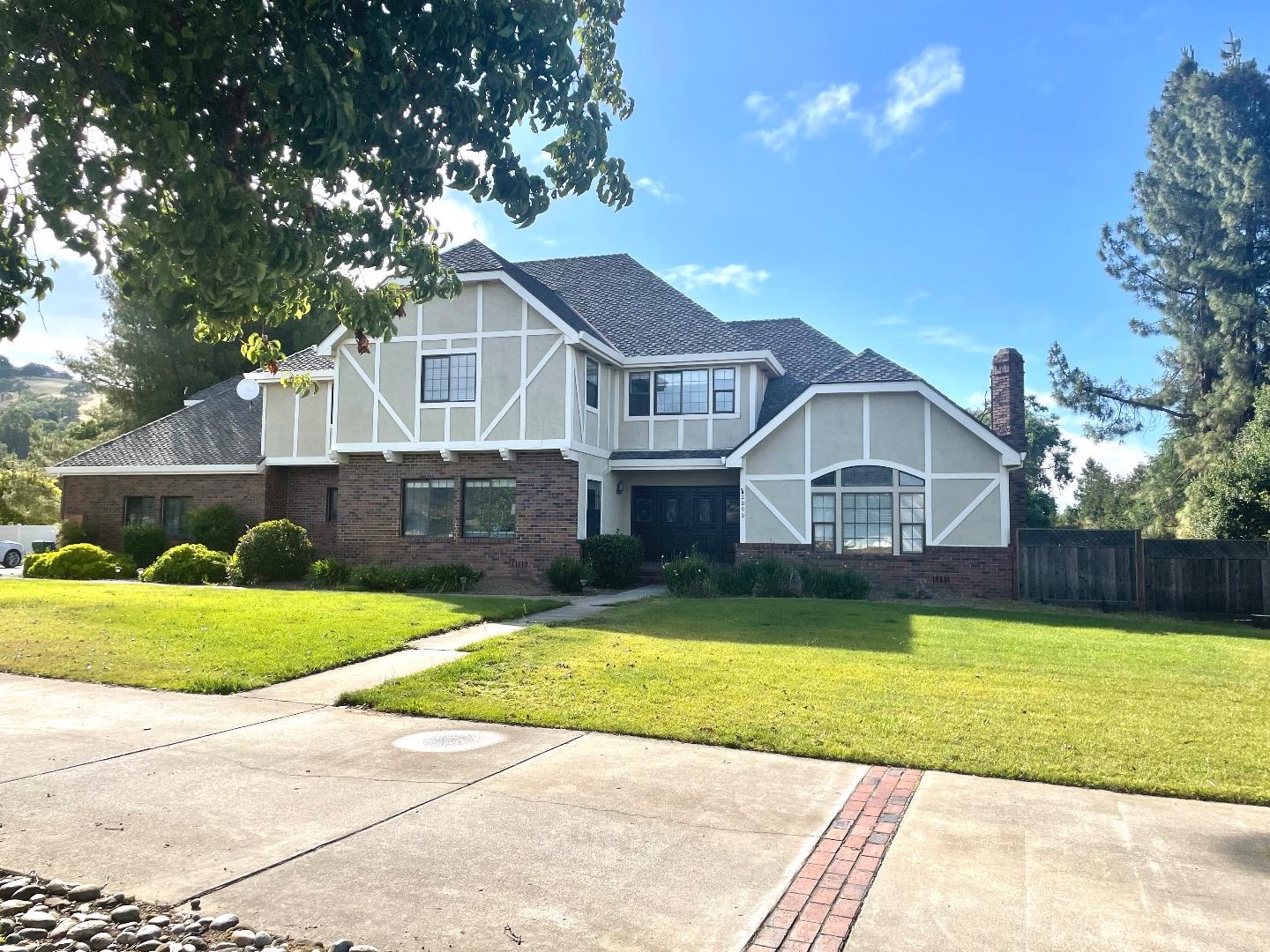 Welcome to this Windermere Estate Home situated on a nice Cul-de-Sac located across from Borello Estates! Flat 2.5 Acres with a separate ADU. Total of 6 Car Garage! Sparkling Pool and Spa! The Main House has 6 Bedrooms, 3 Bathrooms. Huge Primary Suite includes a Super Large Walk In Closet! The downstairs bedroom has been used more for an office. Spacious Living Room with High Ceilings! The kitchen features abundant cabinetry and a separate Butlers Pantry with an additional Stove top and Sink! The ADU has 2 Bedrooms, 1 Bathroom. The 2nd 3 Car Garage has a 1 car that is attached to the ADU. Views of our beautiful mountains, and close proximity for commuting! This estate has so much potential!!!