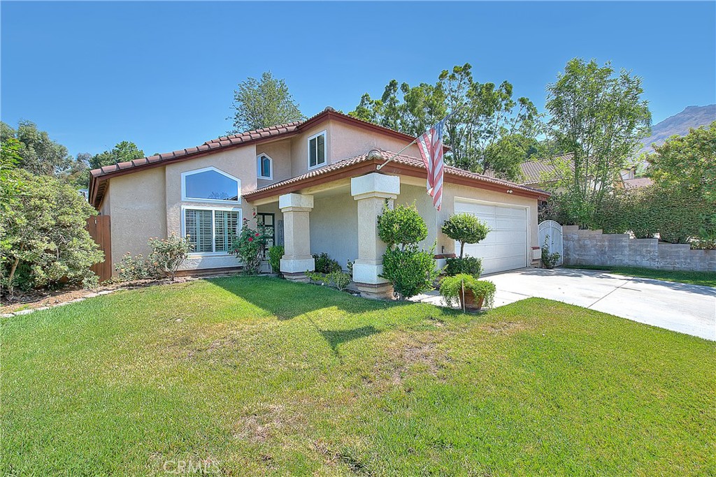 Nestled in the highly sought-after community of Grand Terrace, this meticulously maintained, turnkey home offers a perfect blend of modern upgrades and timeless charm. Boasting a spacious and thoughtfully designed layout, this residence is ideal for those seeking comfort, privacy, and elegance.
The grand living room welcomes you with soaring ceilings and abundant natural light pouring in through large windows, creating an inviting ambiance. Upgraded plush carpeting complements the airy space, while the rich hardwood floors in the family room add warmth and sophistication. The remodeled kitchen is a chef’s dream, featuring granite countertops, a central island with a vegetable sink, all stainless steel appliances including a Thermador range and Bosche double ovens, custom pull-out cabinets, and a sunny breakfast nook. A vaulted ceiling and skylight illuminate the space, making it the perfect spot for cooking or entertaining guests.
Here on the first floor, you'll find a versatile bedroom with a nearby beautifully renovated bathroom, perfect for guests or family members. The indoor laundry room enhances convenience, leading to an oversized backyard designed for relaxation and entertainment. The private backyard is beautifully landscaped with tropical flowers in bloom, a vegetable garden, citrus trees, and a spacious patio area—ideal for hosting gatherings or enjoying peaceful evenings outdoors.
The luxurious primary suite features a cozy fireplace, a spacious walk-in closet with custom shelving, and a large bathroom with a soaking tub, and his and hers sinks—creating a private retreat within your home. Two additional sizable bedrooms share a charming Jack-and-Jill bathroom with ample closet space.
The exterior is equally impressive, with mature trees providing shade and privacy, a sizable side yard enclosed by an iron gate, and lush landscaping throughout. The home boasts numerous updates, including newer windows, tall baseboards, window shutters, and rich wood flooring downstairs—showcasing quality craftsmanship and attention to detail.
This home effortlessly combines elegance, functionality, and privacy—a rare find in Grand Terrace. Move-in ready and impeccably maintained inside and out, it offers a welcoming haven for your family and a wonderful space to create lasting memories. Make time to see this lovely home today. Call us for a personal tour!