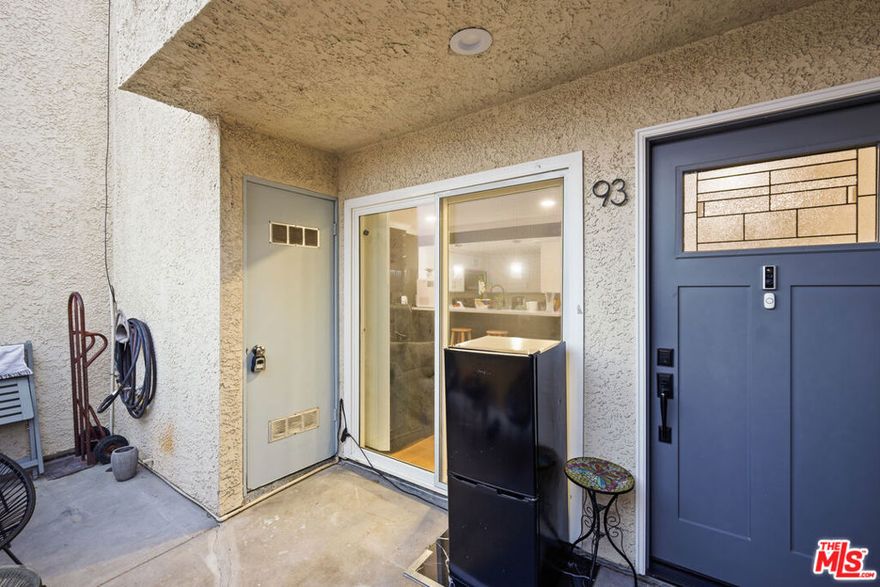 Completely remodeled set above and back of community property for relaxing peace serenity! New: laminate floors, bath tile, cabinets, appliances, green fireplace, bar, TV, custom fixtures, crown moldings. Views, canyon views,  central heat and air, attached tandem parking, pool, tennis/basketball courts. Gated for maximum security. Seller will pay for buyer closing costs.