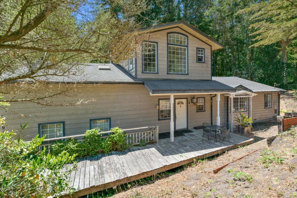 Opportunity knocks! This property needs some TLC but has lots of potential to make it your own. Great floor plan layout with almost all living on the ground floor except for an additional living room with full bath, wood burning stove & private deck on the 2nd level. Perhaps potential for an additional master suite or in-law suite. Also, there is a very large finished area above the 3 car garage with exterior stair access that could be perfect for an exercise room, home office &/or a great place for extra storage. The main floor has a family room with wood burning fireplace and high ceilings that opens to the kitchen with skylight and a separate laundry room. There are multiple decks that overlook the creek and a large side yard that has potential to create your own retreat.
