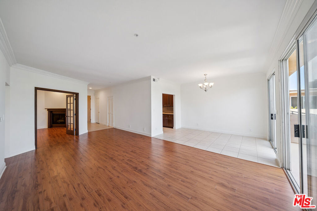 Tenant Pays: Gas, Electricity, and Trash. Owner Pays: Water, Landscaping. Parking: 2 Tandem Garage Parking Spaces Included. 4th story unit ( Penthouse unit ). Massive Patio with views !!! Gated building. In unit laundry hookups! Refrigerator Not Included. Pets Allowed. Close to UCLA! Available Immediately! Welcome to this stunning 2-bedroom, 2-bathroom + Den haven nestled in the heart of the coveted Westwood neighborhood, just moments away from UCLA. Step into this inviting unit and be embraced by its expansive open floor plan, illuminated by abundant natural light dancing off the gleaming hardwood laminate floors. This meticulously updated residence boasts a suite of stainless steel appliances adorning the modern kitchen, complemented by elegant granite countertops and recessed lighting throughout. The spacious living area extends seamlessly onto a generous balcony, offering the perfect sanctuary for relaxation or unwinding after a bustling day. Convenience is key with in-unit laundry hookups and ample storage space thoughtfully integrated throughout the unit. The master bedroom beckons with its luxurious amenities, including a separate Jacuzzi tub and shower, as well as a walk-in closet for added comfort and organization. Parking is a breeze with two tandem spots included within the secure gated entry and parking area, providing peace of mind and ease of access. Don't miss the opportunity to call this Westwood gem your new home sweet home. Schedule your viewing today!