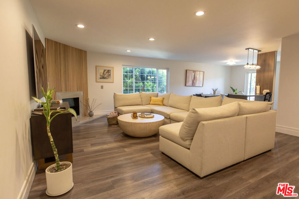 Welcome to this spacious 2-bedroom, 2.5-bath condominium in the heart of Sherman Oaks. This bright and inviting residence features an open floor plan with a large living room with fireplace, dining area, and a private balcony. The updated kitchen comes equipped with premium stainless steel appliances, abundant cabinet space, and sleek modern finishes perfect for both everyday living and entertaining. Both bedrooms include en-suite baths, with the primary suite featuring a walk-in closet. Additional highlights include in-unit laundry, central air/heat, and two assigned parking spaces in a garage. The well-maintained building offers amenities such as a jacuzzi, spa, and controlled access. Ideally located in downtown of Sherman Oaks, close to trendy shops, restaurants, and easy freeway access.