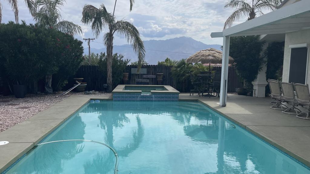 Located high on the hill with spectacular views and very private. 3 Large bedroom 2 baths with a light and open living room. A great room design with 13 foot ceiling. a seamless transition to the tropical back yard , covered patio and large resort size pool & spa. Enjoy the spectacular Mountain and City Views. Leave the big city and buy here in the Desert where your money buys you more house for the Dollar.