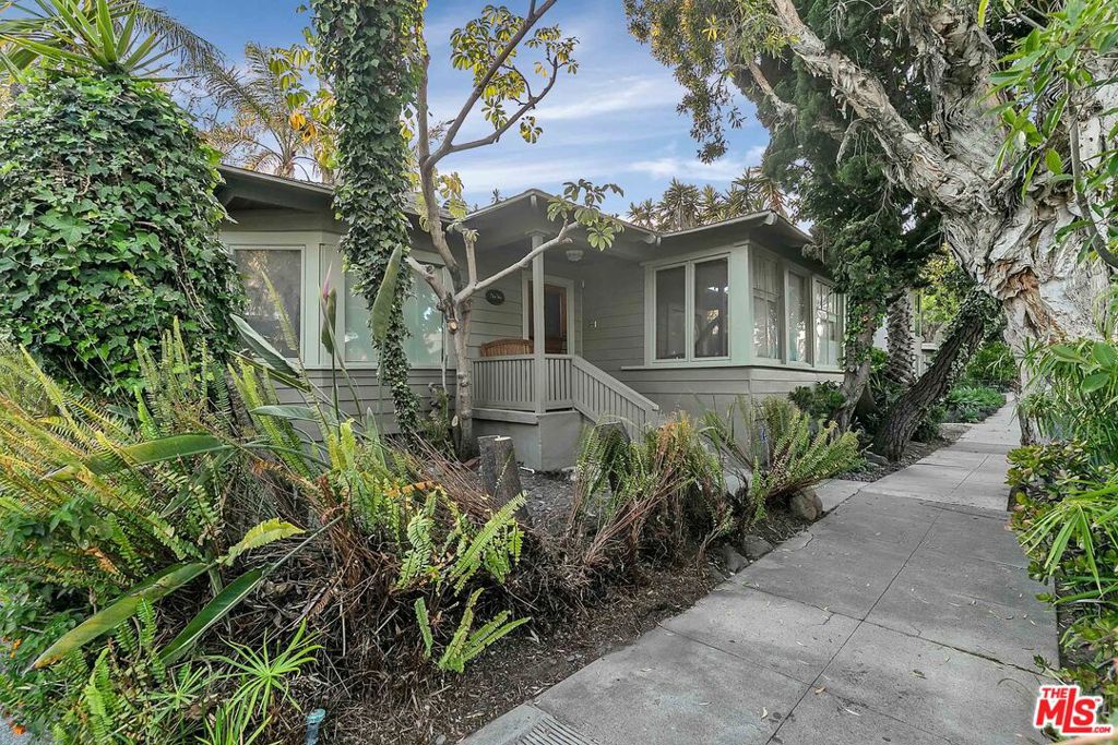 Live just half a mile from the beach in this very RARE, fully free-standing one bed + one bath + den DREAM house! Come inside and you're greeted with TONS of character from hardwood floors to bay windows, and even a cozy fireplace. In the kitchen, you'll find tons of cabinet and counter space, along with a stainless steel oven, stove, microwave, mini fridge, dishwasher, AND a washer/dryer. The charm continues into the large bedroom where you'll find plenty of closet space and an en suite bathroom with a deep, jet tub! Bubble bath anyone?? And did we mention the den?! This beautiful bonus room features tons of built-in shelving and gorgeous natural light so you can create your own optimal office, reading retreat, or whatever else you can dream up. Finally, open up the rear French doors to your very own private oasis complete with a multi-tiered patio. Can't you just picture your next backyard BBQ with friends? Or maybe just lounging with your favorite cocktail and furry friend (small pets are welcome and will love this outdoor space too)! And talk about location! You'll be steps away from Ocean Park and Main Street with their many eateries and shops. You won't even need your car! This gem won't last long so come and see it today!