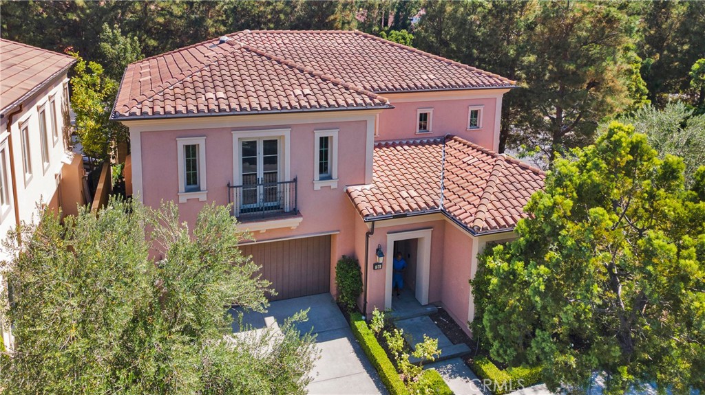 Highly coveted Residence 3 in the guard gated community of Laguna Altura, Cortona! Ideally situated on a rare corner lot with no neighbors on three sides, this home offers exceptional privacy and an abundance of natural light. The thoughtfully designed floor plan features 4 bedrooms + a large bonus room, 4 bathrooms, including a convenient main-level bedroom and full bath. The open-concept great room flows seamlessly into the gourmet kitchen with granite countertops, stainless steel appliances, large center island, ample cabinetry & oversized, walk-in pantry. Upstairs, the spacious primary suite boasts a spa-like bath and dual walk-in closets. Designer features incl all new interior paint, extensive use of wood shutters, crown molding, recessed lighting & added ceiling fans throughout. Inside laundry room incl washer/dryer. Added storage cabinets in garage + water softening system & electric car charger. Enjoy the Southern California lifestyle with indoor-outdoor living and a private wraparound yard perfect for entertaining. Located within the award-winning Irvine Unified School District including University High School and just minutes from world-class shopping, dining at the Irvine Spectrum, and minutes to Laguna Beach. Community amenities include parks, pool, spa, clubhouse, and 24-hour guard-gated security. A rare offering in one of Irvine’s most desirable neighborhoods!