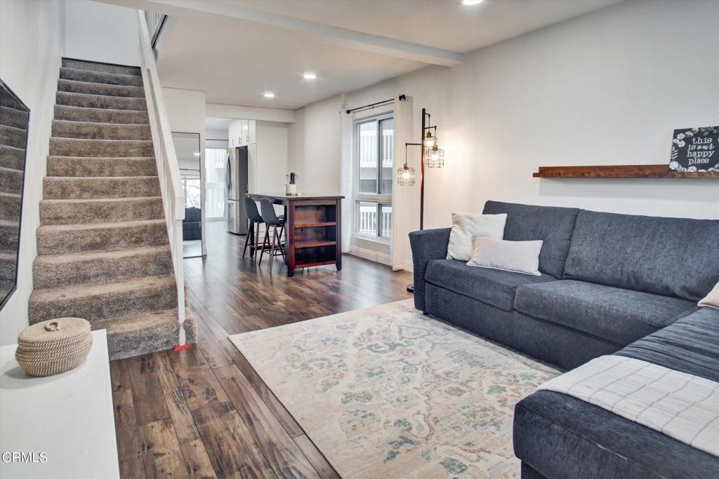 Welcome to beachside living at its best! This completely remodeled 2BR/1.5BA corner unit is located in the desirable Anacapa View Association community in Port Hueneme--just moments from the sand and surf. Spread across the 2nd and 3rd floors, this light-filled home offers extra windows and wrap-around balconies off the kitchen and primary bedroom, perfect for enjoying pool views and ocean breezes. Every detail has been updated from floor to ceiling! Features include recessed lighting in the living and dining areas, stylish laminate flooring throughout, quartz counter tops, a full-size stacked washer and dryer in the kitchen, stainless steel appliances, and extra cabinetry for added storage. The upstairs bathroom is beautifully upgraded with tile flooring, a tiled tub wall enclosure, a new vanity, mirror, and lighting. The half bath downstairs has also been completely remodeled. Enjoy the benefits of dual-pane windows and sliding doors, plus a newer water heater for added peace of mind. This floor plan offers a larger kitchen area compared to other 2BR units in the community. The spacious primary bedroom also features a walk-in closet. The guest bedroom has a private entrance/ exit door. The community amenities include a pool and spa, clubhouse, paddle tennis court and putting green. The HOA dues cover water, sewer, and trash. One designated carport and an additional parking permit to park onsite. Don't miss this opportunity to live near the beach in a stylish, move-in ready condo!
