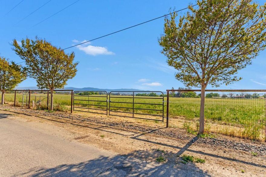 Just Listed Lot #2 Bluff Dr. Stunning 5 acre lot in North County. Off Comstock Rd. Discover the perfect opportunity to build your dream home on this stunning 5-acre lot in Hollister's sought-after North County. Offering privacy, tranquility, and breathtaking country views, this spacious lot is ideal for creating your own sanctuary. Imagine a custom-built residence or a peaceful retreat in a serene rural setting, just minutes from town. Don't miss your chance to own a piece of North County's beautiful landscape and make your countryside living dreams a reality! Located in the Ausaymas Valley, this lot sits on a plateau above Santa Clara Valley, just 7 miles from Hollister. The plateau provides a unique microclimate and great views of the valley below, nestled behind the Three Sisters Peaks of the Diablo Range. These lots are practically "Build Ready" with approved building and septic locations defined on the maps. PG&E is available at the property edge (Bluff Road), and irrigation water can be accessed by connecting to San Benito Water (blue valve) along Bluff Road. Domestic water will need to be provided by drilling a new well.