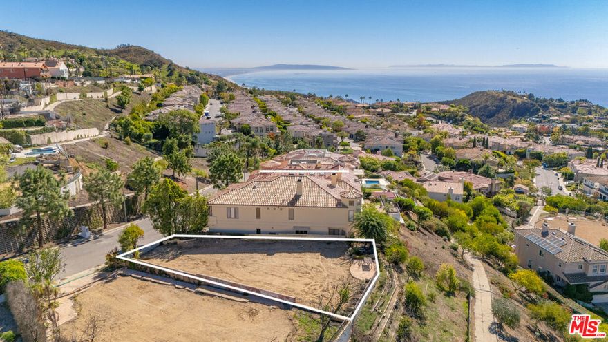 This exceptional property is located in the prestigious Summit of Palisades Highlands community and offers breathtaking panoramic views of the ocean and mountains. Nestled on a quiet street, this flat lot previously accommodated a 4,383SF home and includes a recorded easement granting access to the adjacent land below. Land was maintained by owner and used as a beautiful private garden. Residents of The Summit enjoy exclusive access to the recently reopened Summit Club, featuring resort-style amenities such as tennis courts, a clubhouse, fitness center, basketball court, swimming pool, and more. The neighborhood also includes a gated lower park with off-leash dog park hours, a baseball diamond, jogging path with workout stations, and a children's playground. This is an incredible opportunity to build your dream home in one of the most sought-after areas of the Palisades Highlands and enjoy an exceptional coastal lifestyle. HOA fees: $400/month for the Summit Club and $90/quarterly for the dog park. Phase 1 and Phase 2 have been completed.