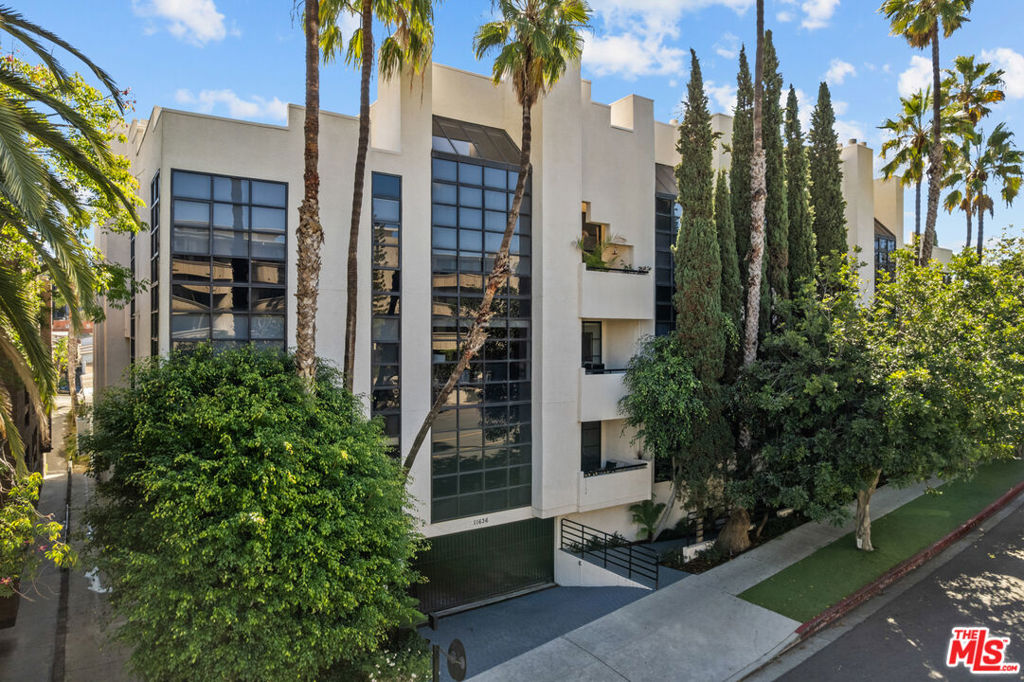 Spacious 2 bed, 2.5 bath townhome-style condo in prime Brentwood location, just minutes away from restaurants, coffee shops and retail on trendy San Vicente Blvd. Located in a quiet corner of this contemporary condominium building, with lovely center courtyard pool surrounded by lush mature landscaping. As you enter you are greeted with the high ceilings and tons of natural light that make this home different from most condominiums. There is a powder room perfectly situated at the entry before you step down into the spacious living room with wood floors, soaring ceilings, romantic fireplace and wet bar, perfect for entertaining. The dining area opens to a patio to capture the cool breeze and is perfectly situated just off the kitchen. The laundry room completes the lower level. The upper level comprises the oversized primary suite with a second fireplace, large walk-in closet, and a spa-like primary bath with dual sinks, walk in shower, separate tub and skylights overhead. The second bedroom, full bathroom and loft area, which can be used as a home office, complete the upper level. Brand new carpets just installed on the upper level. Other building features include controlled access, airy courtyard walkways, 2 single parking spaces, additional storage and 11 guest parking spaces.