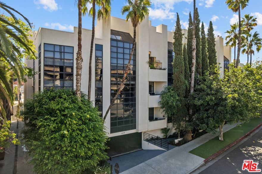 pacious 2 bed, 2.5 bath townhome-style condo in prime Brentwood location, just minutes away from restaurants, coffee shops and retail on trendy San Vicente Blvd. Located in a quiet corner of this contemporary condominium building, with lovely center courtyard pool surrounded by lush mature landscaping. As you enter you are greeted with the high ceilings and tons of natural light that make this home different from most condominiums. There is a powder room perfectly situated at the entry before you step down into the spacious living room with wood floors, soaring ceilings, romantic fireplace and wet bar, perfect for entertaining. The dining area opens to a patio to capture the cool breeze and is perfectly situated just off the kitchen. The laundry room completes the lower level. The upper level comprises the oversized primary suite with a second fireplace, large walk-in closet, and a spa-like primary bath with dual sinks, walk in shower, separate tub and skylights overhead. The second bedroom, full bathroom and loft area, which can be used as a home office, complete the upper level.  Brand new carpets just installed on the upper level. Other building features include controlled access, airy courtyard walkways, 2 single parking spaces, additional storage and 11 guest parking spaces.