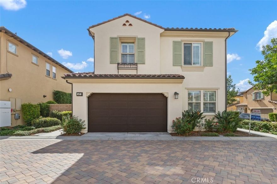 Step inside this Baker Ranch beauty where modern design meets everyday comfort, and discover a home that’s as stylish as it is practical. This newer detached corner lot home offers 4 bedrooms and 3 bathrooms with a thoughtfully designed floor plan that blends comfort, functionality, and modern style. Step through the charming arched front door into a bright, open-concept main level that connects the living, dining, and kitchen areas seamlessly. Gorgeous French oak-styled wood floors set the tone for a warm and inviting space, while large windows and a sliding glass door flood the home with natural light, complemented by custom plantation shutters throughout. The kitchen is a true showstopper with a generous island, upgraded modern backsplash, trendy cabinetry, and a pantry—perfect for both everyday living and entertaining. Adjacent to the kitchen, the main level includes a versatile bedroom or office next to a full bathroom with a sleek glass shower, offering flexibility for guests or a home workspace. Direct access to the oversized two-car garage with storage and cabinets adds convenience. Upstairs, two spacious bedrooms share a full bathroom featuring upgraded tile with a modern design. The well-appointed laundry room with cabinets and a sink makes daily chores easy. On the opposite side, the expansive primary suite enjoys abundant natural light and dual closets, including a walk-in. The luxurious primary bath boasts dual sinks, an oversized glass shower, and a private water closet. Outdoor living is equally impressive. A large wrap-around patio with a permanent gazebo creates multiple areas for dining, lounging, and entertaining. A side gate offers direct community access, while a unique garage door opening to the patio, enhances functionality. Living in Baker Ranch means resort-style amenities at your fingertips: 7 parks, 3 private pool facilities including The Vista Swim Club, The Grove Pool, and The Arbors Pool, along with tennis courts, hiking and fitness trails, and resident programs. With upgraded finishes throughout, including French oak–styled flooring, modern tile, and a stylish kitchen, plus a low tax rate, no Mello Roos, and low HOA, this home is not just beautiful; it’s a smart buy in one of Orange County’s most desirable communities.
