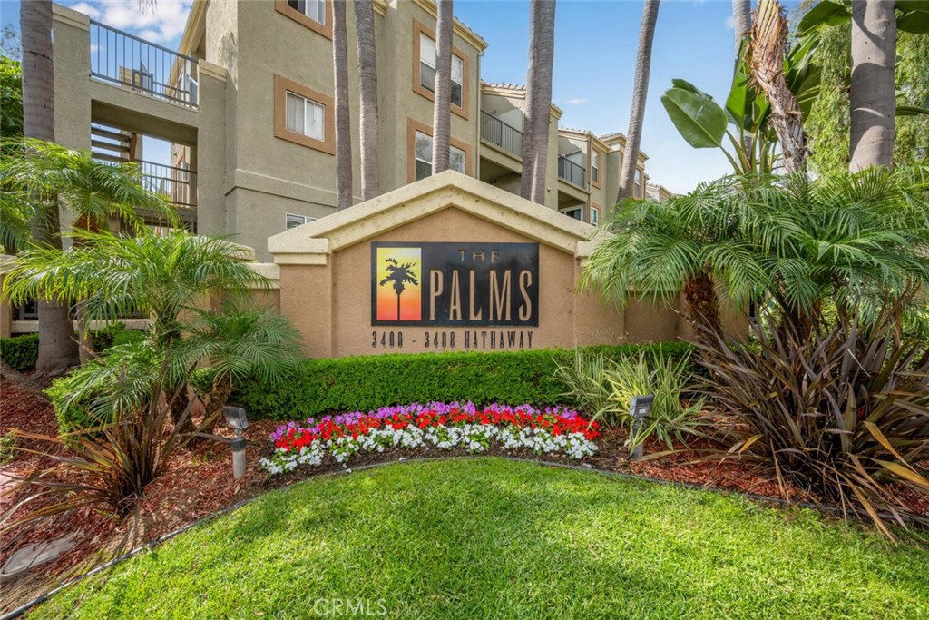 Welcome to this charming 2-bedroom, 2-bathroom turnkey bottom-floor corner unit in The Palms! Freshly painted with brand new vinyl flooring and carpet throughout, this home is move-in ready. The kitchen features granite countertops and stainless steel appliances, perfect for everyday living and entertaining. The spacious primary suite offers an ensuite bathroom and a slider that opens directly to the private patio. There is also a generously sized secondary bedroom, providing flexibility for guests, an office, or more. Enjoy your private entrance and a cozy patio with washer/dryer hookups for added convenience. This unit also features its own 1 car garage along with 1 driveway space for parking. With its thoughtful layout, fresh updates, and super convenient location, this is a home you won’t want to miss!