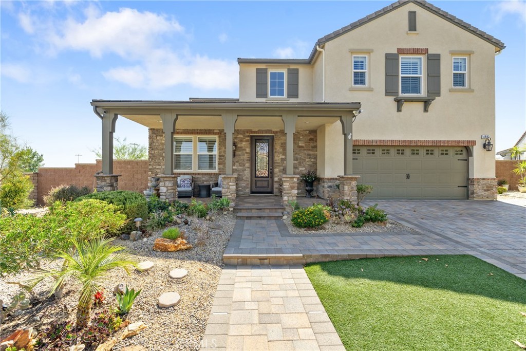 Discover your oasis nestled in a serene cul-de-sac within Van Daele’s premier Avelino community. Polished curb appeal on a quarter acre lot shows pride of ownership. The home was customized with ethernet portals throughout for increased network speed, stability, privacy, and overall bandwidth. A brand new stone-paved driveway, walkway, and porch with ground lighting enhance the home's elegance. Recent upgrades include a custom fiberglass front door, fresh exterior paint, and seamless aluminum rain gutters. At entry, the spacious living areas flow in an open-floor plan concept with natural light, courtesy of high ceilings and expansive windows. 3-inch plantation shutters throughout accentuate the home's elegance creating a sophisticated ambiance. Eco-friendly, fully paid solar panels with a brand new solar inverter and a 220 EV adapter enhance energy efficiency and electricity cost savings. The family room offers plenty of space to include picturesque views of the backyard and a custom built-in ceiling surround sound system. The kitchen features granite countertops, a large custom walk-in pantry, wine rack, stainless steel appliances, and an enormous center island, perfect for entertaining. The first floor also boasts a guest bedroom with an attached full bath, along with an office nook. All bathrooms have upgraded toilets.
The backyard is a true retreat featuring a large covered patio with recessed lighting and a custom built gas-line fire pit, perfect for outdoor gatherings. Enjoy the soothing sounds of a waterfall-pondless creek feature, with meandering pebble pathways and picturesque views of the local vistas and amazing sunsets. The backyard is complete with a turf golf-putting green for endless entertainment. The upper level offers two ample-sized bedrooms that share a Jack & Jill bathroom, while the upstairs laundry room adds convenience. The luxurious Master Suite includes upgraded carpet, dual sinks, a heated/jetted tub, a separate shower, and a large walk-in closet with custom built-ins. From the large Master Deck, savor breathtaking views of the Southern skyline, mountains, and stunning sunsets. The garage is equipped with an EV (220 volt) adapter for convenient electric vehicle charging, a whole house HALO water purification/softener system that ensures clean water throughout the home, a tankless water heater for endless hot water, custom ceiling-mounted lighting and custom wall-mounted cabinets for organized storage.