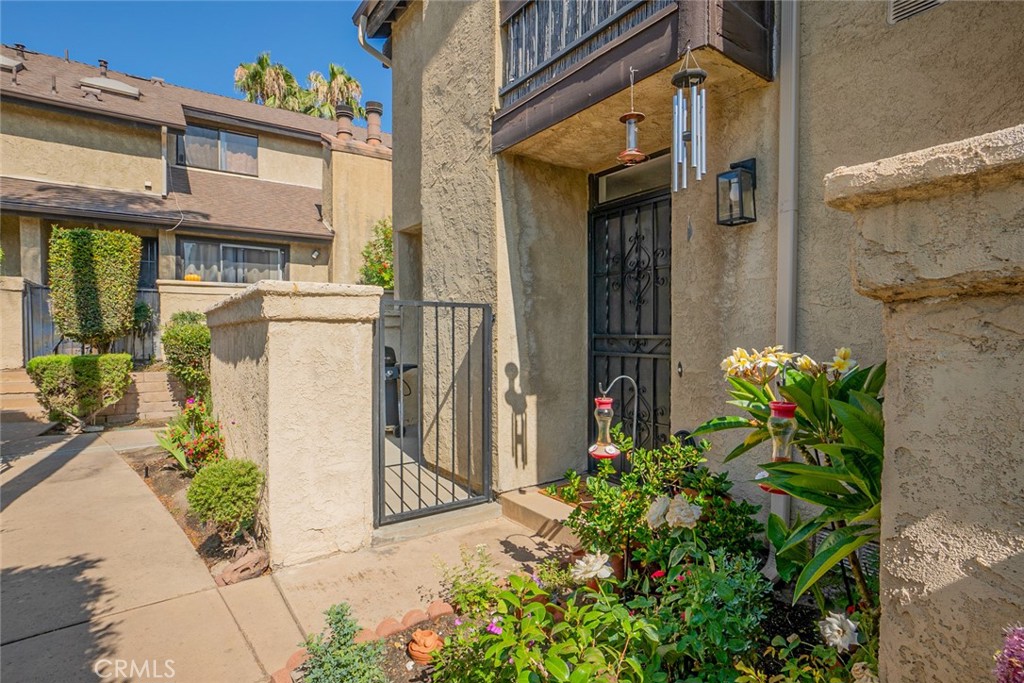 Welcome to this delightful 3-bedroom, 2-bathroom end-unit condo, offering 1,145 sq ft of comfortable living space. This home perfectly blends privacy, functionality, and style, making it an ideal choice for various buyers.
Step inside to an inviting open layout bathed in natural light, seamlessly connecting the spacious living area, dining space, and kitchen. Enjoy your private front patio, perfect for relaxing, entertaining, or savoring your morning coffee. The property boasts tile flooring throughout the main level and laminate wood flooring upstairs. All three bedrooms are located upstairs for privacy. They feature mirror closet doors and closet organizers, with one bedroom offering high ceilings. For added comfort, all bedrooms are equipped with ceiling fans, and two of them provide their own private balcony space. Convenience is enhanced with in-unit laundry hookups located in the two-car garage, and all appliances are included. This home is situated within a gated complex that offers resort-style amenities, including a sparkling pool and spa, lush landscaping, and walking paths. Additional highlights include assigned parking and a prime location with close proximity to shopping, dining, schools, and freeway access.
Whether you're a first-time homebuyer, looking to downsize, or seeking a smart investment opportunity, this move-in ready condo truly checks all the boxes!