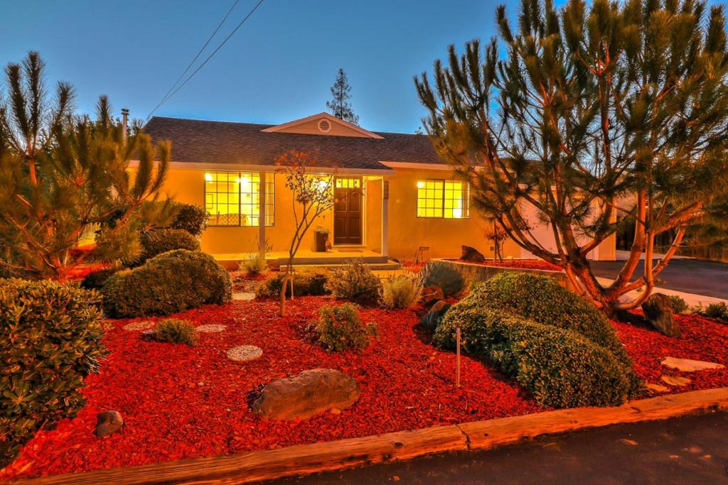 You will not be able to take your eyes off of this four bedroom, three bath San Tomas home with eye-catching curb appeal and an expansive driveway. A charming front porch leads to a sun-filled living room with hardwood floors, recessed lighting and a custom ceiling fan. The spacious kitchen makes cooking a breeze with its tile flooring, commercial-grade appliances, large pantry, center island and dining nook. All bedrooms have ceiling fans. Two master suites have spa-like baths and walk-in closets. One master suite opens to a private patio. The additional bedrooms are nicely sized. The backyard retreat features a covered patio, hardscaping, greenery and drought-tolerant landscaping. Other features include a detached garage with carport parking, a solar-powered electrical system and central heat and air. Dont miss this rare opportunity!