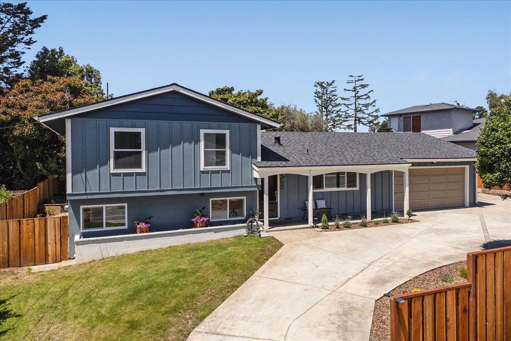 You will fall in love with this beautifully renovated, move-in-ready split-level home in the coastal part of Aptos. Designed for comfort, style, and functionality, the open-concept main level features a modern kitchen with a large island, quartz countertops, sleek finishes, and ample storage. The kitchen, dining, and living areas flow seamlessly together and open through a pair of sliding doors to a spacious, flat, sunny backyard perfect for entertaining, gardening, or relaxing in the fresh coastal air beneath the shade of a beautiful Magnolia and Olive tree. A few steps up are three bedrooms, including a peaceful primary suite, and a stylishly updated full hallway bathroom. A few steps down offers a large family room with backyard access, a fourth bedroom, and a full bathroom ideal for guests or multi-generational living. A bonus room provides flexible space for a home office, art studio, or exercise room. Recent upgrades include a new roof, new windows, hardwood floors, modern bathrooms, and recessed lighting. The expansive lot includes a circular driveway, a two-car garage, and space for a boat or RV. Take your morning or evening walks to the nearby beach or Seascape shops, and enjoy everything this vibrant Aptos neighborhood has to offer. This is coastal living at its best!