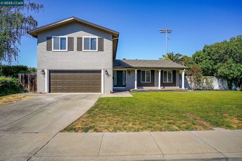 Sleek front entry doors w/ vertical glass inserts, hardwood floors in living room and dining room. Spacious kitchen & breakfast nook, double ovens, glass cooktop, microwave. Family room with laminate floors, wet bar, brick FP w/ insert. 4 carpeted bedrooms upstairs, all closets cedar lined floors. Dual pane windows. All bathrooms have windows. Primary bath has new countertop, stall shower. Hall bath has double sinks, shower over tub, subway tile surround, heat lamp light .Whole house fan to cool down during hot spells.Covered wood deck & patio, lawn and irrigation well. Close to Trader Joe's, Whole Foods, restaurants, hiking & biking on Contra Costa Canal trail.