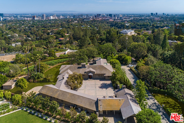 Trophy Estate Site with panoramic views in the most Prime section of Bel Air. Minutes to Sunset Blvd and Bel Air Hotel. Over 55,000 sq ft (1.2 acres) mostly level with existing 7,942 sq ft residence and vineyard. Sweeping views from Downtown Los Angeles to the Pacific Ocean. Surrounded by Estates in excess of $100M. This is a rare opportunity to acquire the finest. Shown only to prequalified buyers.