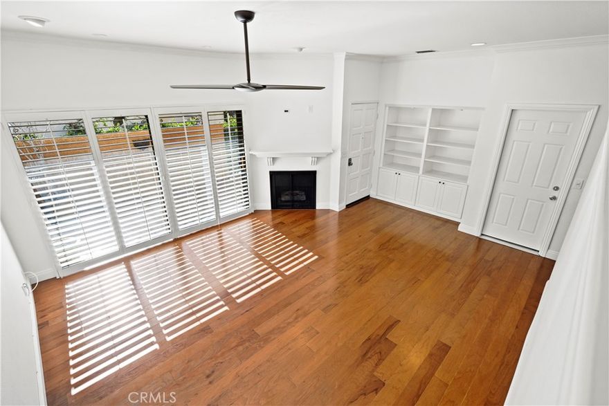 Welcome to this beautifully updated split-level townhome in highly sought-after gated Tarzana Villa North. From the landscaped, secured entrance, to the home’s thoughtful multi-level layout and abundant natural light, it offers rare privacy and comfort.  
A spacious tiled private patio extends your living space, ideal for morning coffee, outdoor dining, or relaxing outdoors. Inside, you’ll find high ceilings, rich hardwood floors, custom plantation shutters, central air and heat, modern Minka Aire ceiling fans in every room, custom wrought-iron stair railings, wainscoting (wall paneling), crown molding, and crisp white walls for an airy, designer feel across all levels.
The elevated dining area overlooks the large living room, creating an open, architectural flow.  The kitchen offers generous granite counters, white cabinetry, a wide breakfast bar, custom millwork, and an included Jenn-Air refrigerator in excellent working condition. A spotless, beautifully maintained powder room completes the main level. All appliances, including a near -new matching washer and dryer (pictured) are included. 
The existing fireplace is decorative; a buyer may choose to replace it or install an electric or modern gas unit.
 
Upstairs, the oversized primary suite easily fits a king bed and seating area.  It features a large walk-in closet with full custom-built-ins, and premium Berber-style carpet.  The ensuite bath includes a long double-sink vanity, separate makeup area, and a private water closet with walk-in shower. 
The second bedroom has high ceilings, a custom cedar-lined closet with added cabinetry and a balcony overlooking the pool – a rare highlight in this community.  A beautifully tiled full bath with natural stone and a tub shower combo serves this room and the upstairs hall.  

Recent upgrades include:
• New washer and dryer.
• New water heater.
• New Genie garage door opener with 3 remotes.
• New Nest smart thermostat with wi-fi.
• New AC installed in 2017
 
Everyday conveniences set this home apart: mail is delivered directly into the garage via mailslot, and trash pickup is right outside your garage door - no long walks to mailbox clusters or shared trash areas. The building is gated and secure with well-kept grounds.